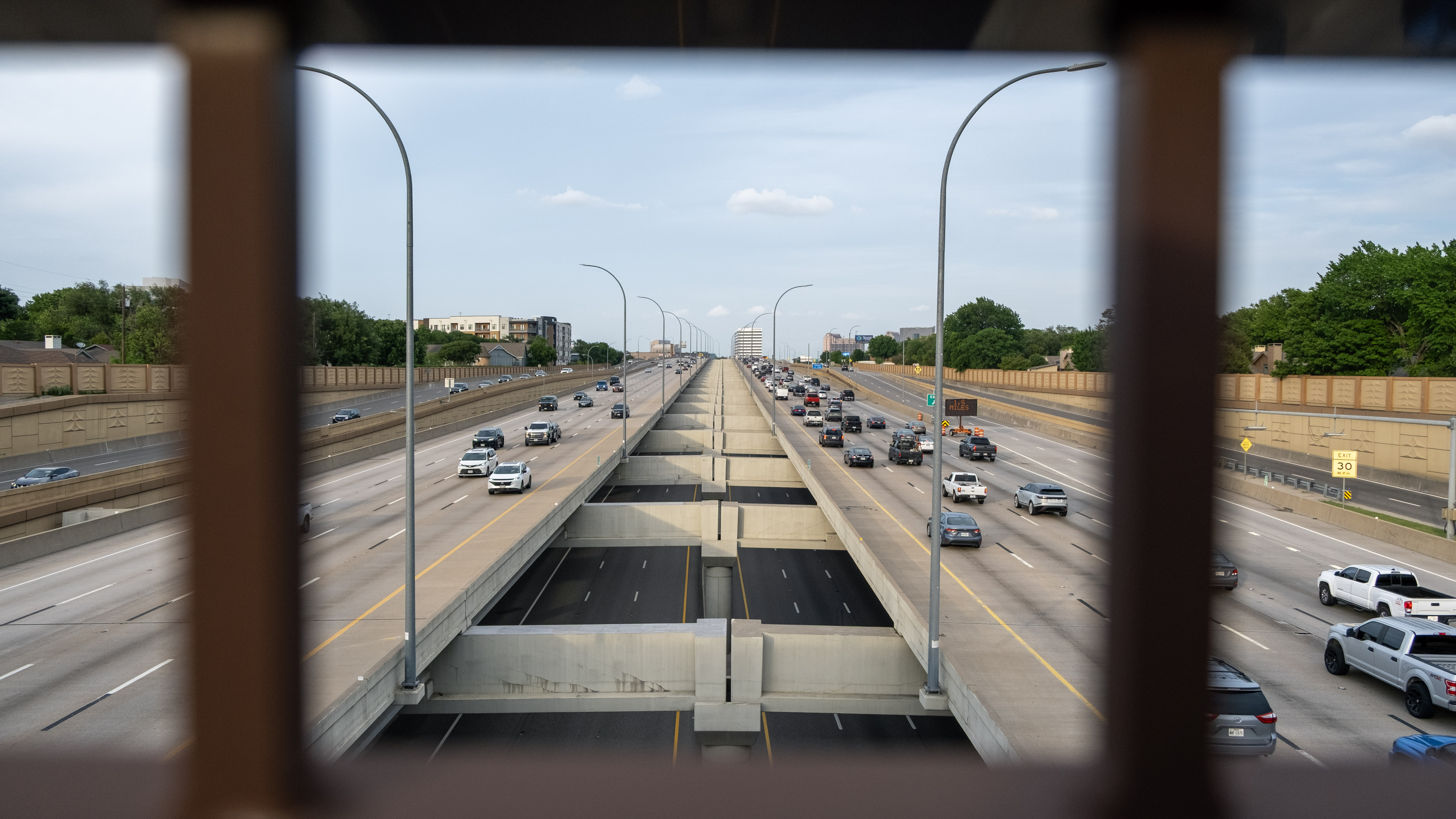 looking at cars on the highway from an overpass
